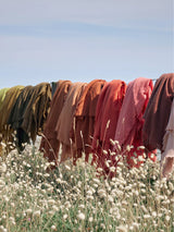 Fringed cashmere throw in Sand