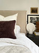 a square shearling pillow in chocolate brown shearling