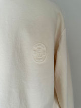 a comfy easy to wear sweatshirt in cream ivory with 'vintage' embroidered upside down for an abstract look