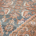 Close-up of a patterned rug with earthy tones