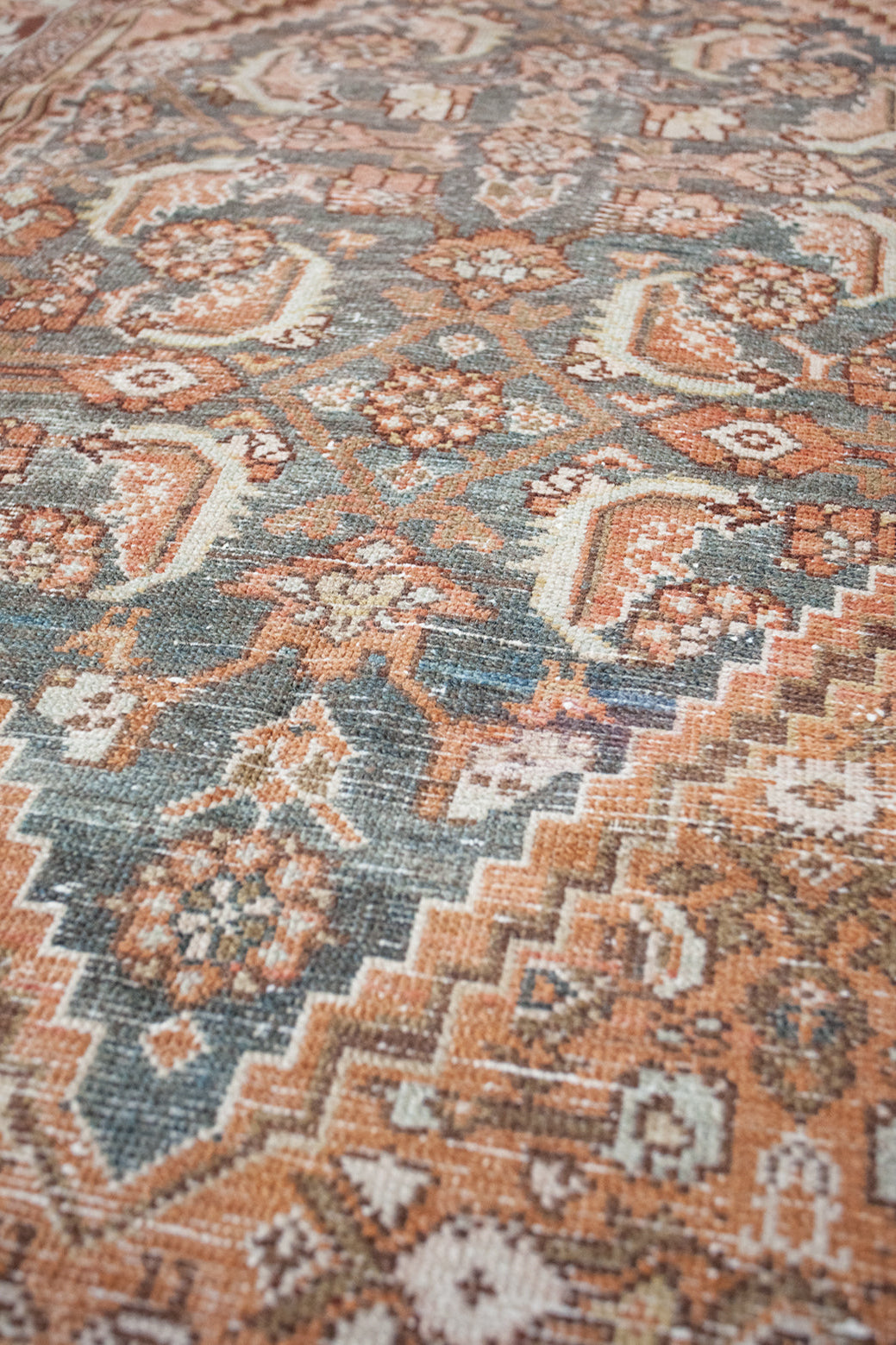 Close-up of a patterned rug with earthy tones