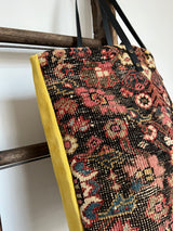 an overnight tote bag with vintage mahal rug and mustard suede leather
