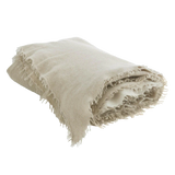 Fringed cashmere throw in Sand