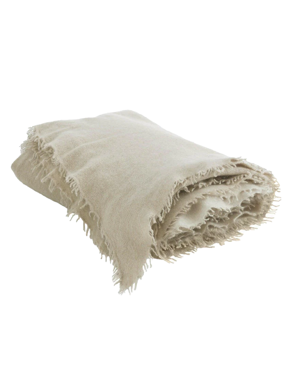 Fringed cashmere throw in Sand