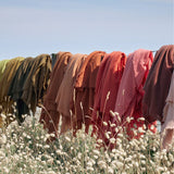 Fringed cashmere throw in Ocre