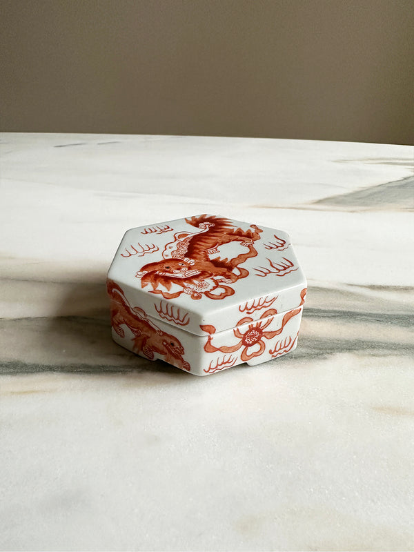 little hand painted chinese dragon trinket box in white ceramic with orange paint
