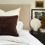 a square shearling pillow in chocolate brown shearling