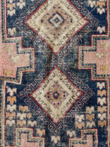 an antique-afshar-rug-with pink and blue details and two cream central medallions