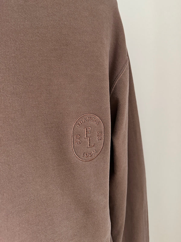 a comfy easy to wear sweatshirt in faded mink brown with 'vintage' embroidered upside down for an abstract look