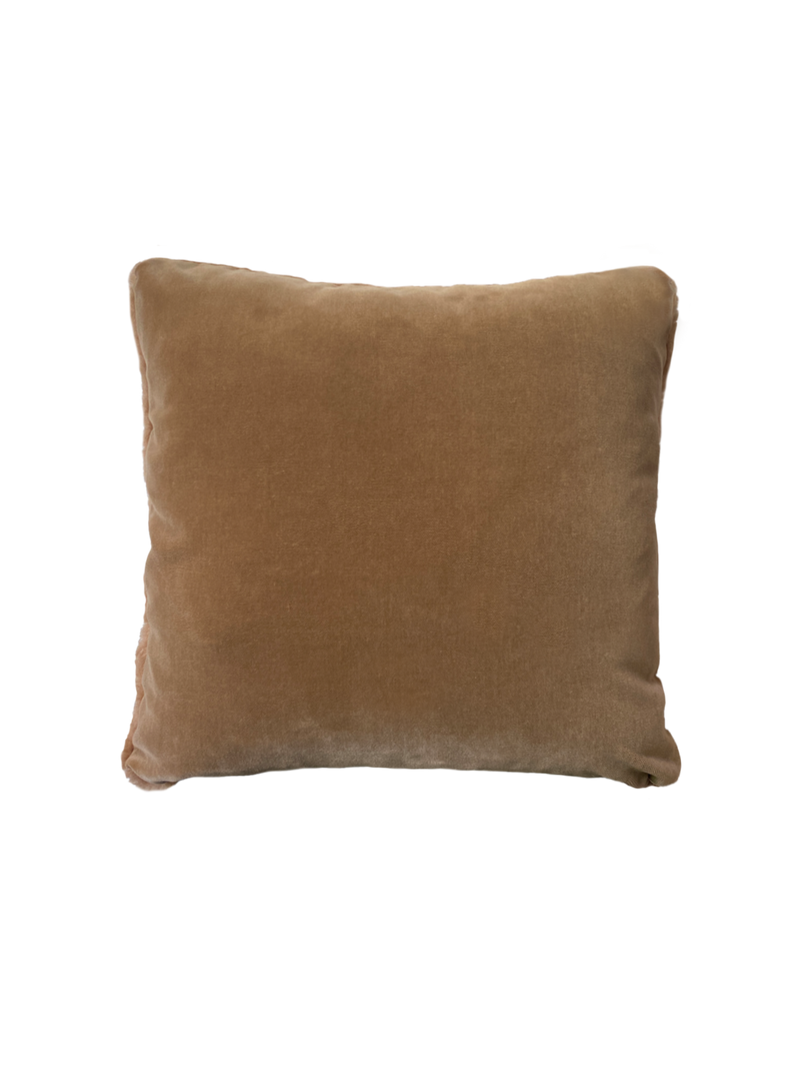 a shearling pillow in camel colored velvet with a plush velvet backing and exposed brass zipper