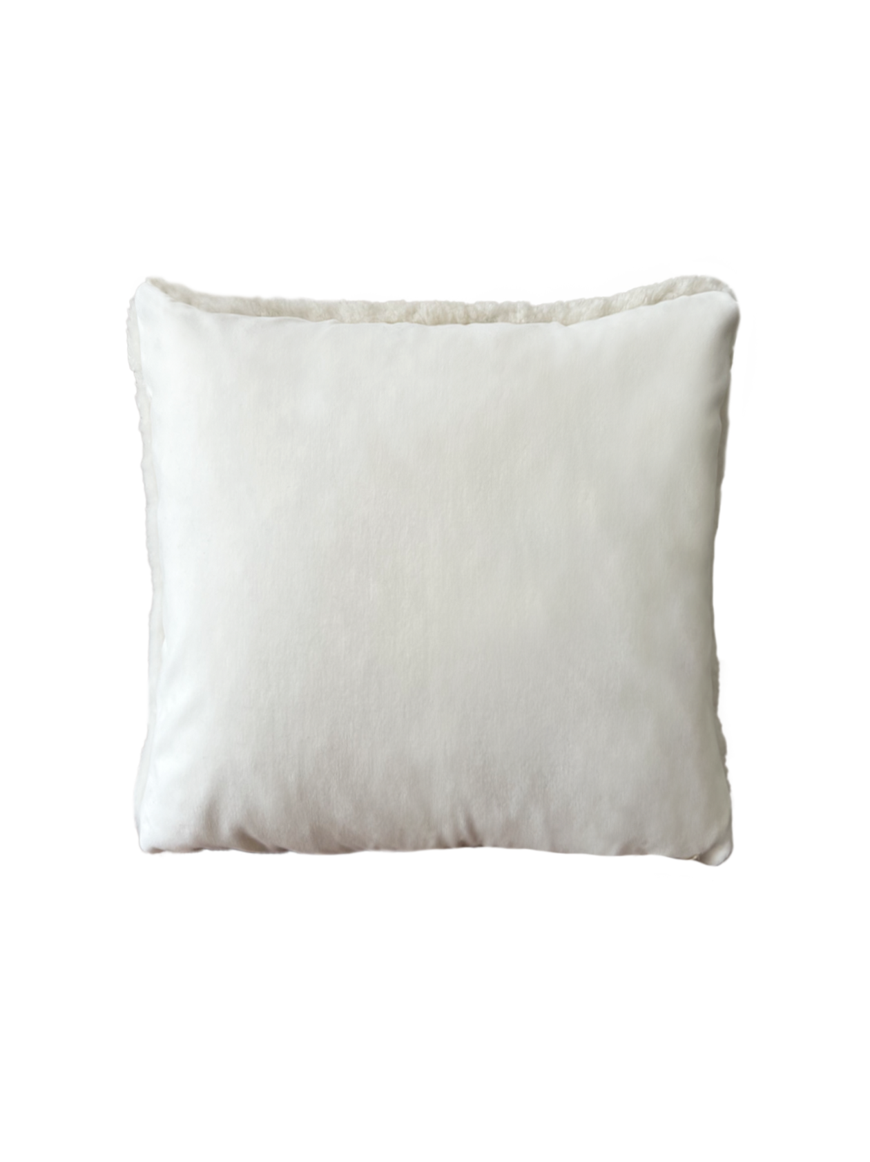a white shearling pillow backed in plush velvet, with an exposed brass zipper