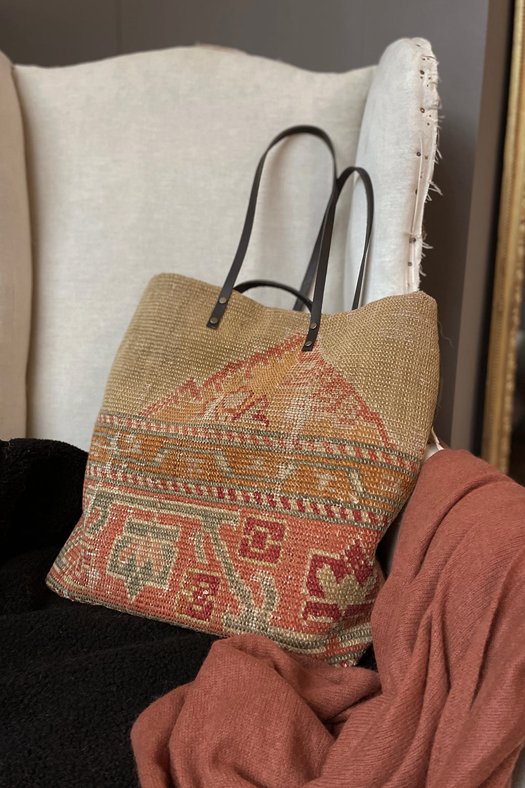 Textured handbag with intricate patterns on a chair