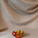 Vintage gilt cup with coral handle
