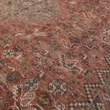 Close-up of a patterned rug with earthy tones