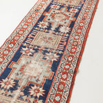 Decorative rug with intricate patterns on a white background