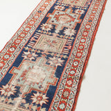 Decorative rug with intricate patterns on a white background