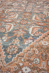 Close-up of a patterned rug with earthy tones