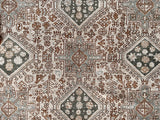 a large heriz karajah rug with blue and brown accents and multiple medallions