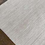a hand braided jute rug in natural undyed sisal