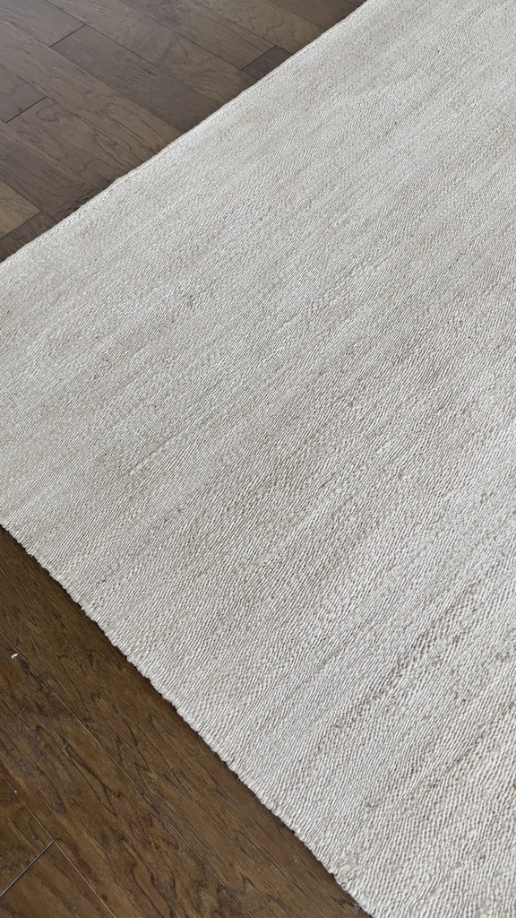 a hand braided jute rug in natural undyed sisal