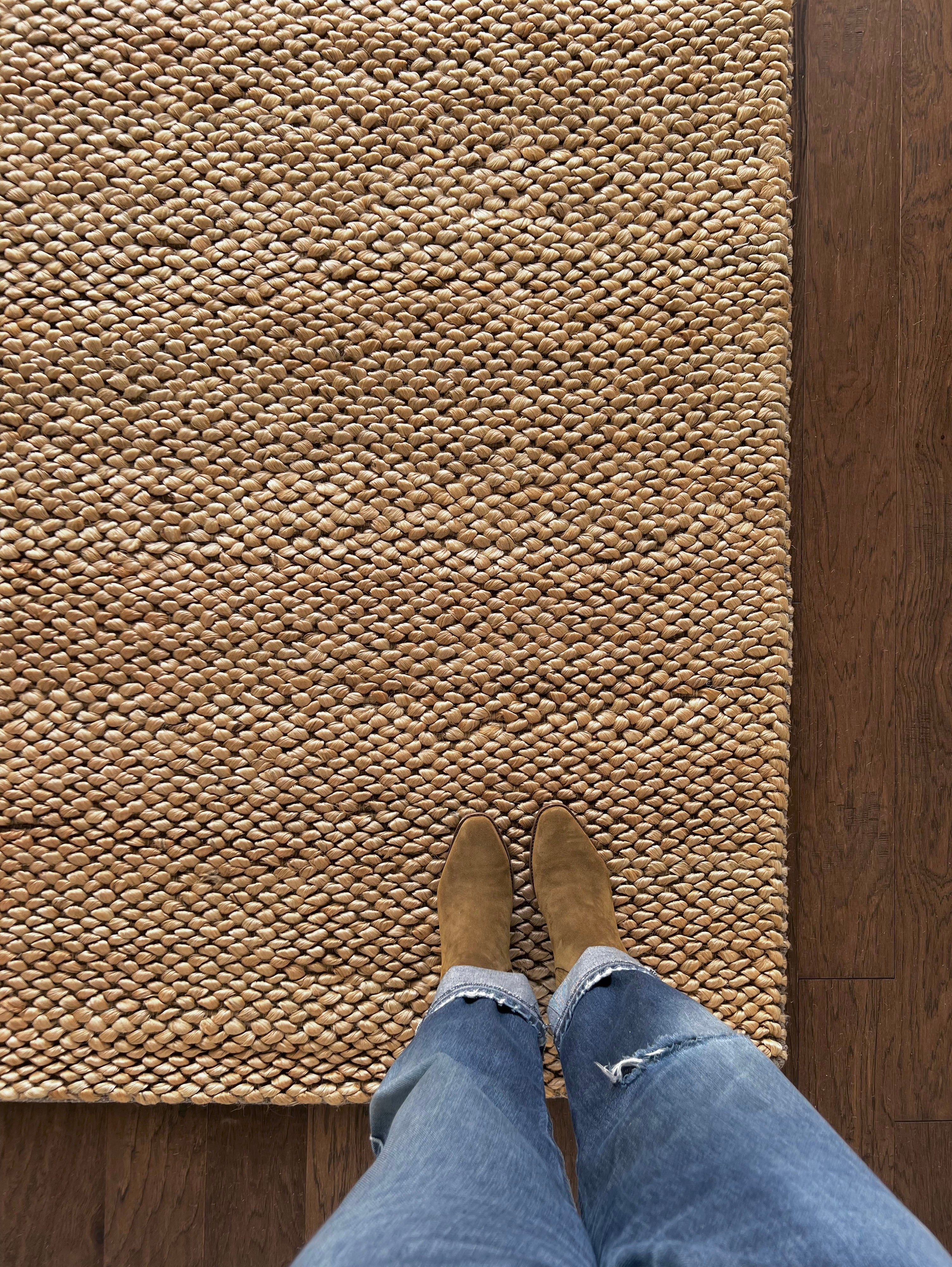 a chunky braided jute rug with ombre caramel tones