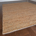 a chunky braided jute rug with ombre caramel tones