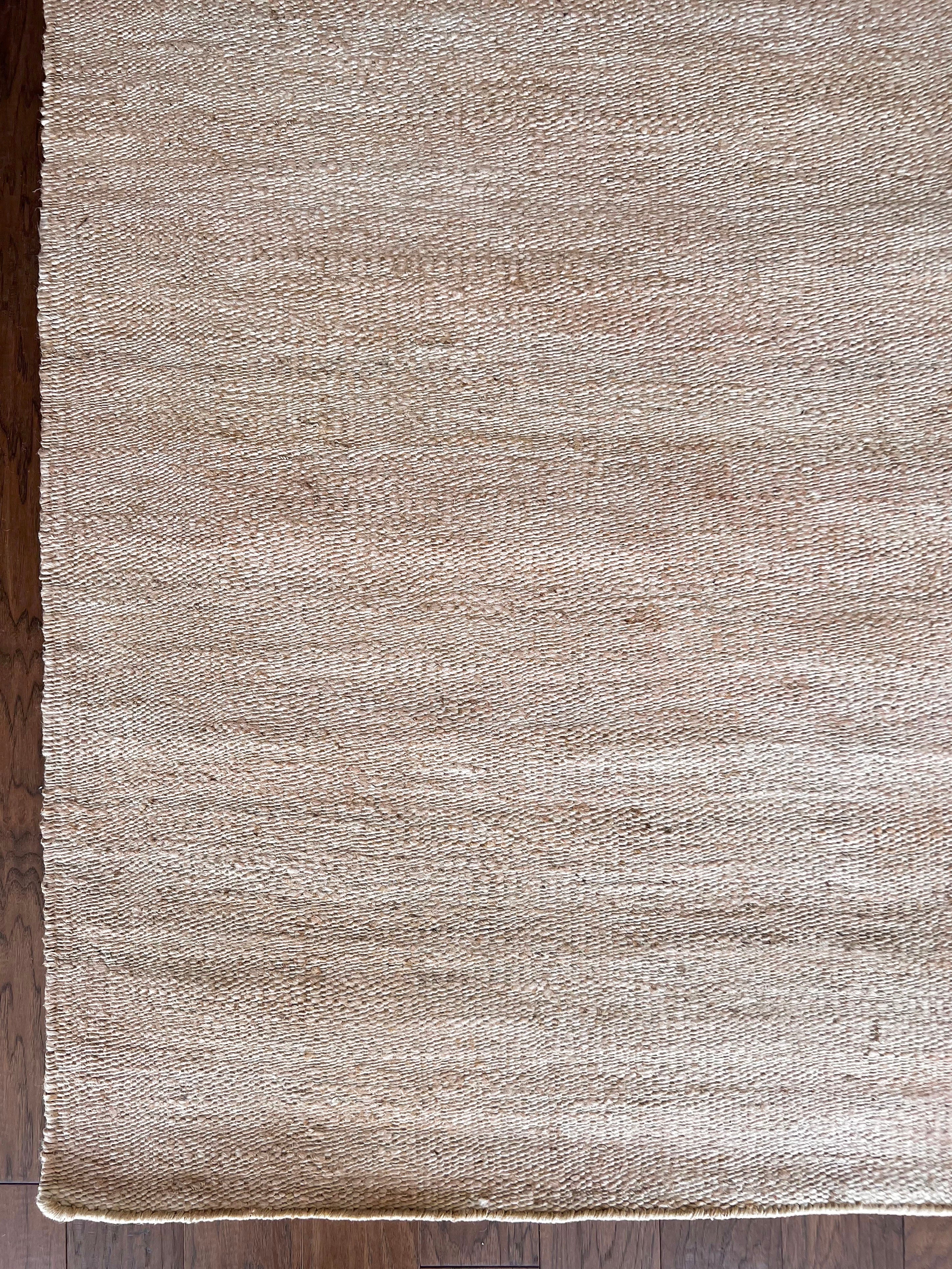 a hand braided jute rug in natural undyed sisal